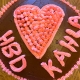 chocolate birthday cake with pink decorations