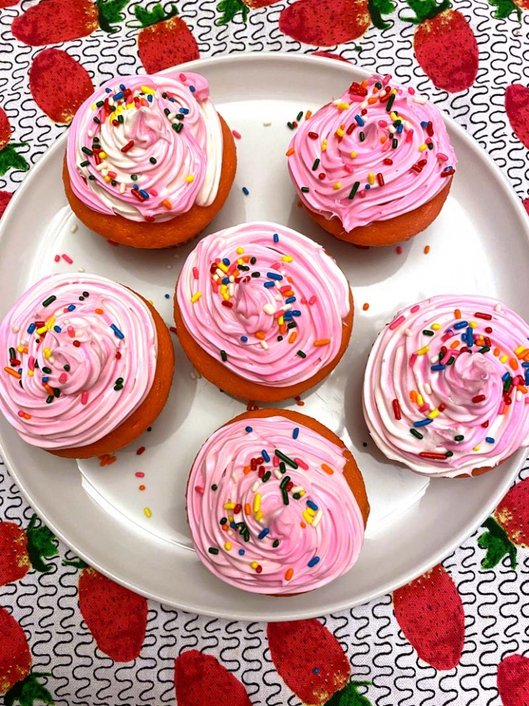 pink cupcakes with rainbow sprinkles