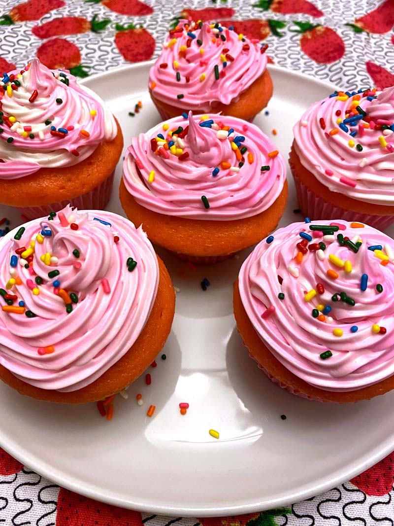 pink cupcakes with rainbow sprinkles