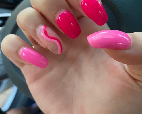 Different Shades Of Pink Nails With Ring Finger Swirl Design