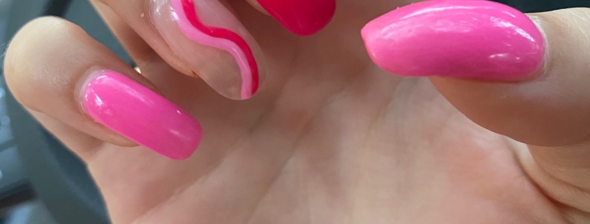 Different Shades Of Pink Nails With Ring Finger Swirl Design