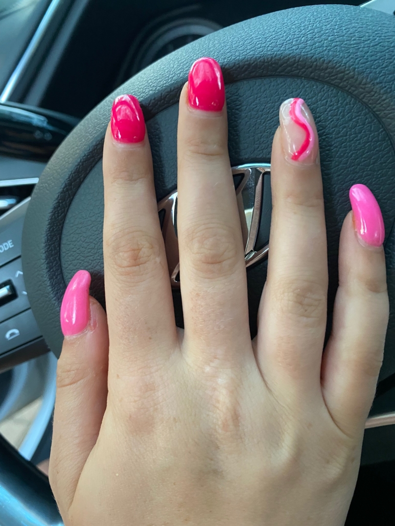 hot pink nails with diamonds on ring finger