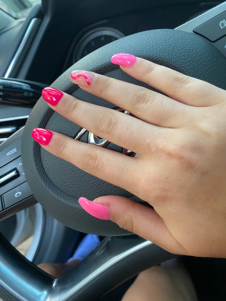 hot pink nails with diamonds on ring finger