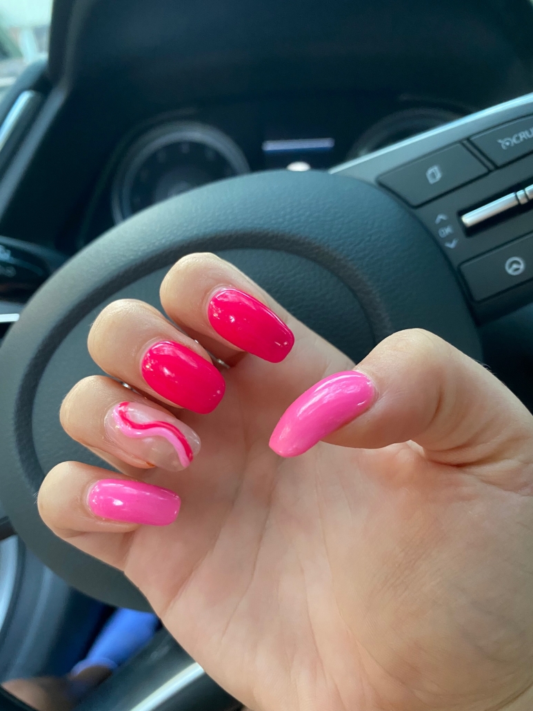 hot pink nails with diamonds on ring finger