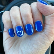Cobalt Blue Nails With White Heart Design On Right Finger