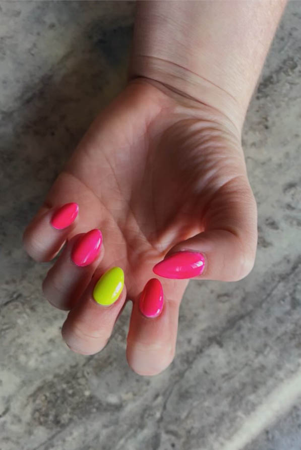 Bold and bright summer nail design in hot pink and neon yellow