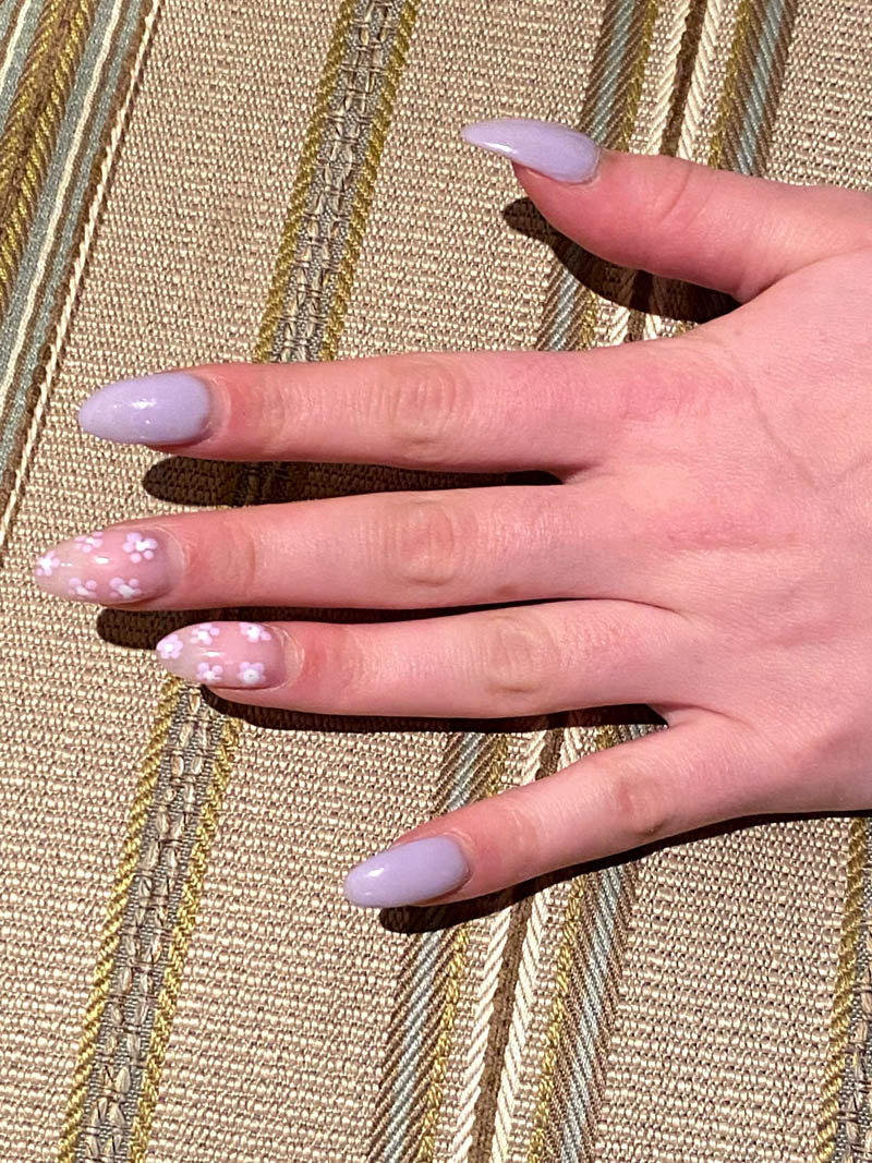 hot pink nails with diamonds on ring finger