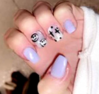 purple nails with smiley happy face and abstract design on two fingers