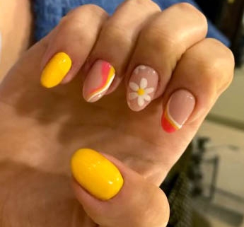 yellow and orange nails designs with flowers and swirls