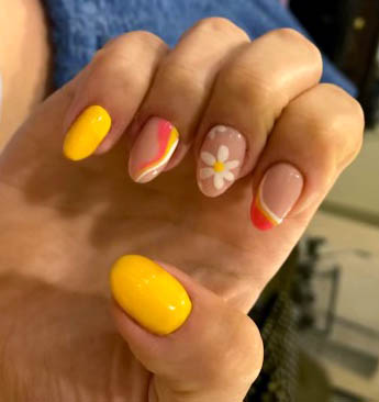 yellow and orange nails designs with flowers and swirls