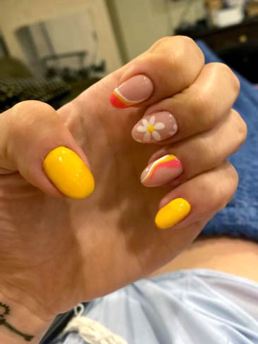 yellow and orange nails designs with flowers and summer swirls