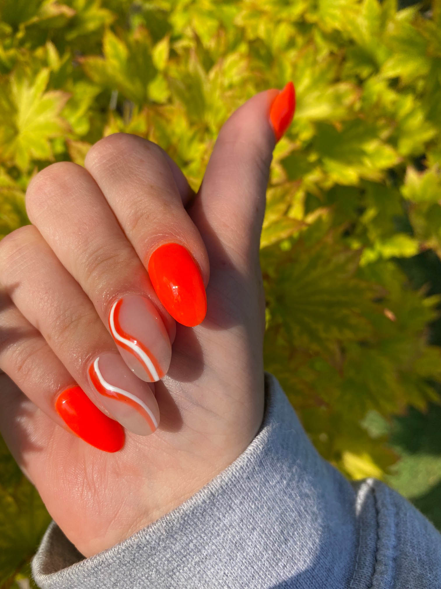 Bright Orange Nails With White Swirls Design Tutorial