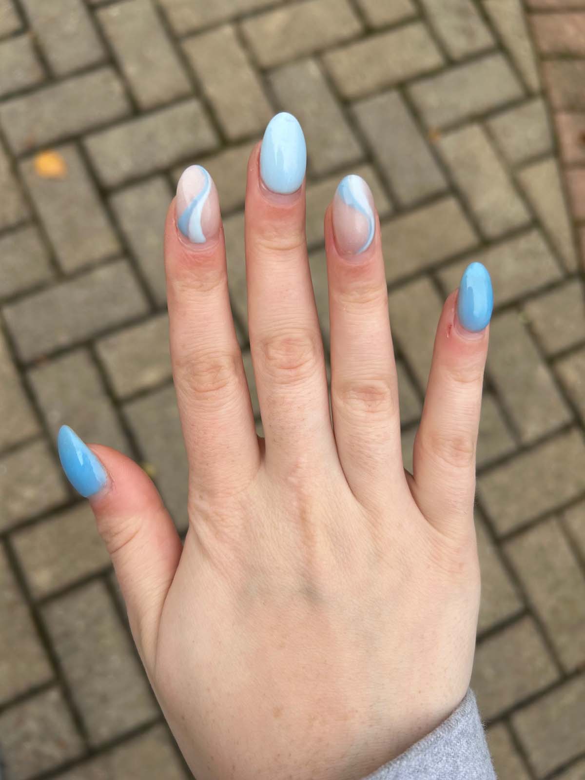 Different Shades Of Blue With Swirls Accent Nails Design Inspo