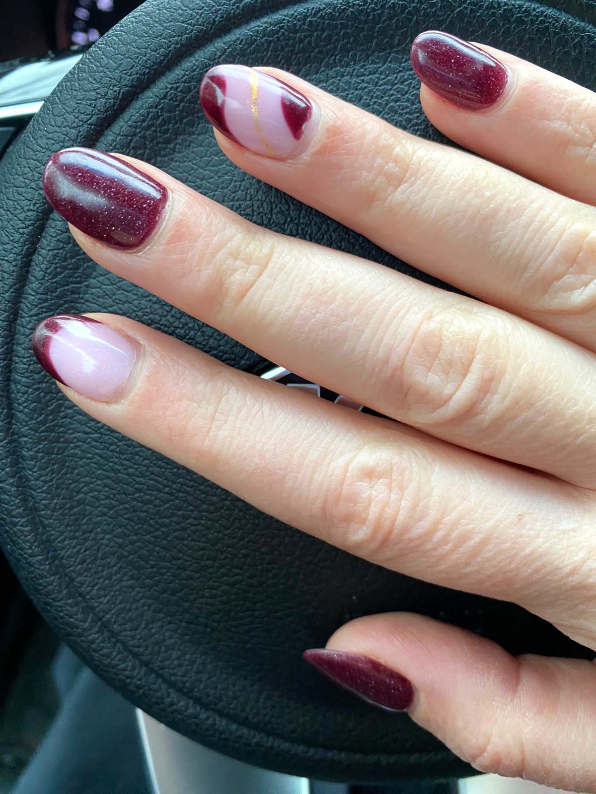 dark red nails with gold