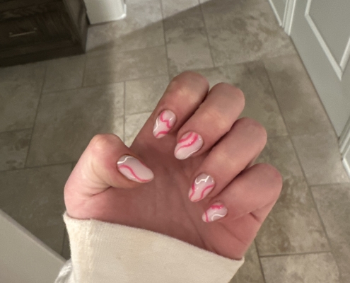 Pink and white swirl nails