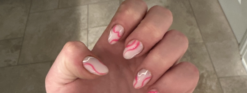 Pink and white swirl nails