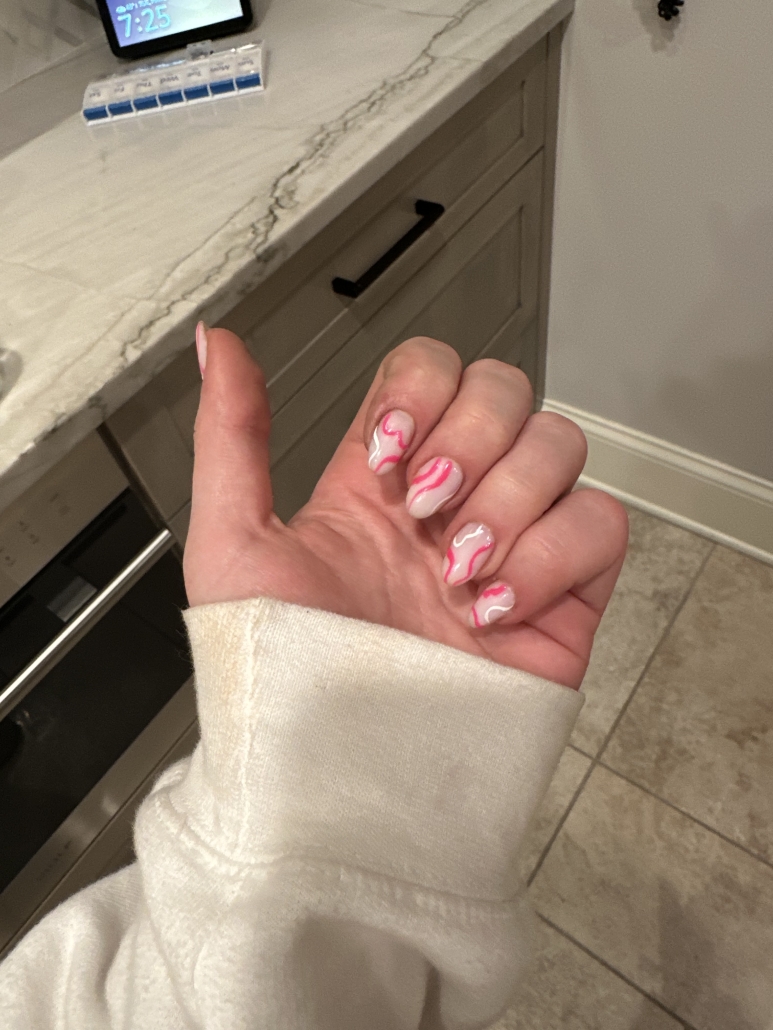 Pink white swirl nails