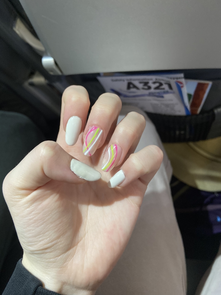 White nails pink green design