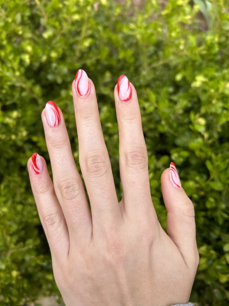 Red swirls nails