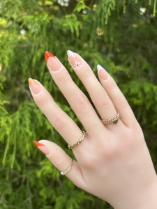 Orange French Tip Nails with Flowers Design
