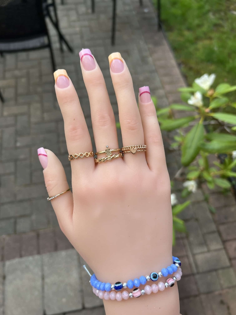 Pink yellow French tip nails