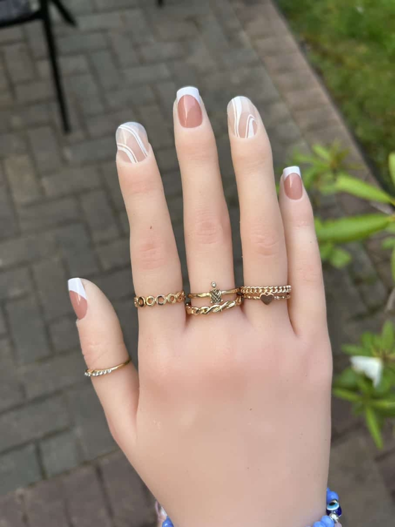 Beige nails white swirls