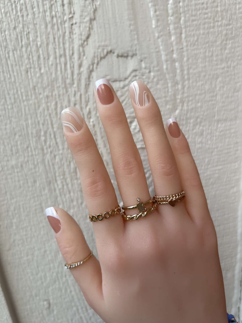 Beige white swirl nail